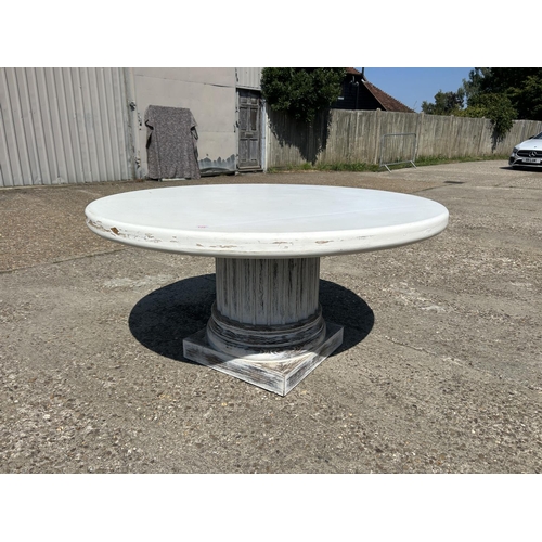 221 - A large white circular dining table on thick painted pedestal base 148cm diameter