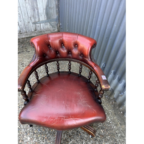 222 - A red leather chesterfield swivel chair captains chair