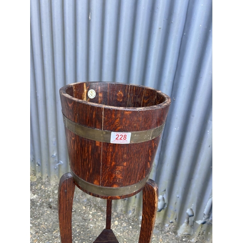 228 - A brass banded oak plant stand