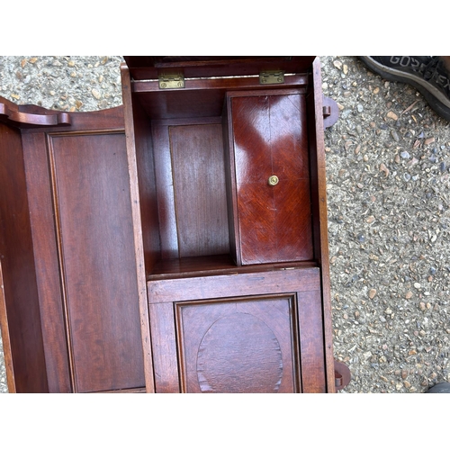 233 - A mahogany wall cabinet, table and  piano stool