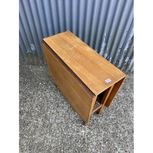 235 - A teak gate-leg table