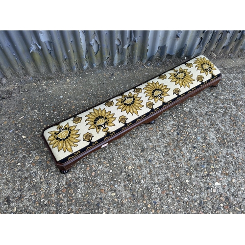 238 - A Victorian mahogany footstool upholstered to the top  120cm