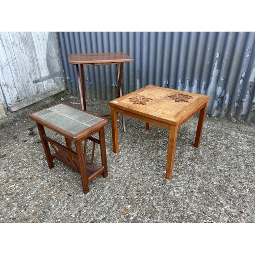 242 - Teak magazine rack, tile top table and a folding table