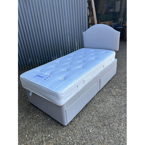 253 - A modern grey two drawer single divan bed with Nestledown mattress (hardly used)