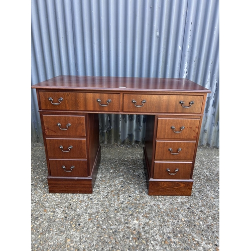 255 - A mahogany reproduction twin pedestal desk 107x50x78