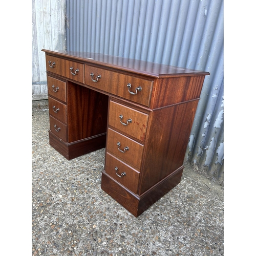 255 - A mahogany reproduction twin pedestal desk 107x50x78