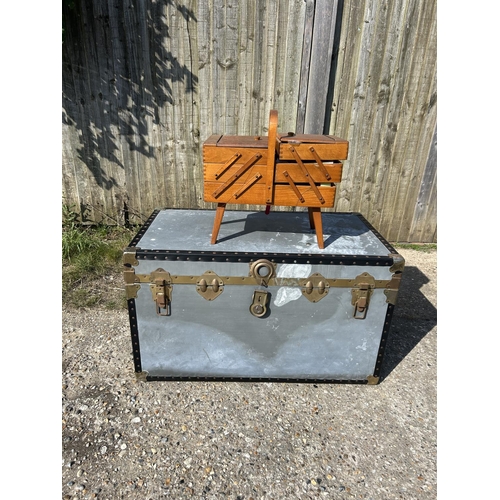 257 - A large vintage trunk together with a concertina sewimg box