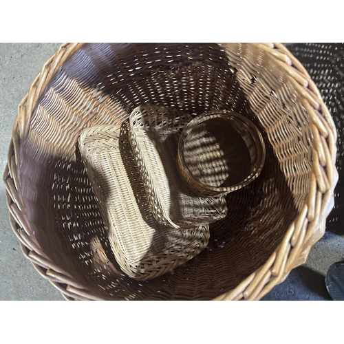 262 - Four large wicker baskets and three small pieces of basketware