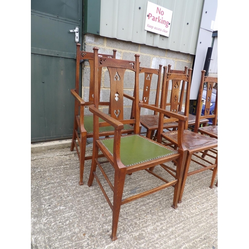 34 - A set of six oak arts and crafts dining chairs (inc 2 carvers)