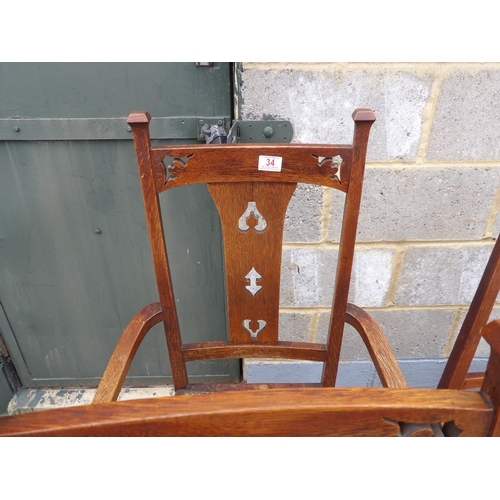 34 - A set of six oak arts and crafts dining chairs (inc 2 carvers)