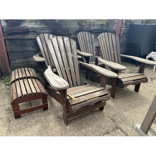 428 - A set of four wooden sun lounger chairs with two stools