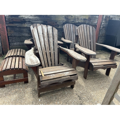 428 - A set of four wooden sun lounger chairs with two stools