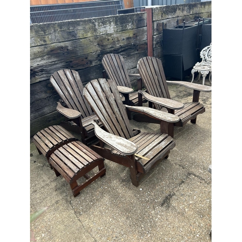 428 - A set of four wooden sun lounger chairs with two stools
