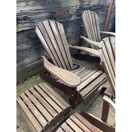 428 - A set of four wooden sun lounger chairs with two stools