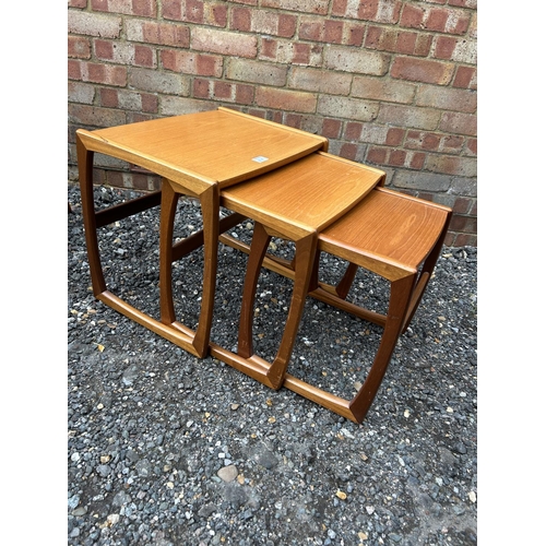 45e - A teak nest of three tables