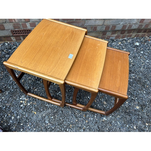 45e - A teak nest of three tables