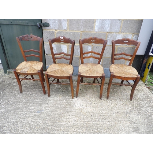 47 - A set of four French rush seat kitchen chairs