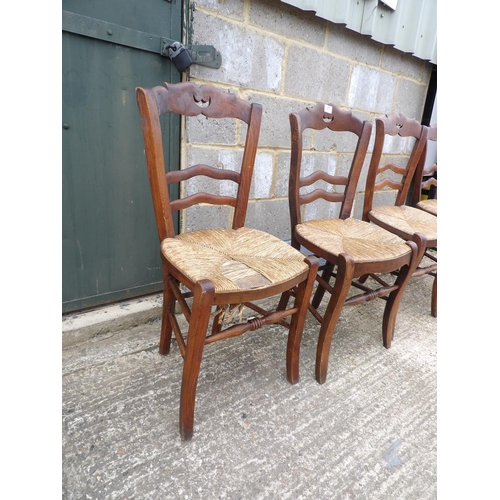 47 - A set of four French rush seat kitchen chairs