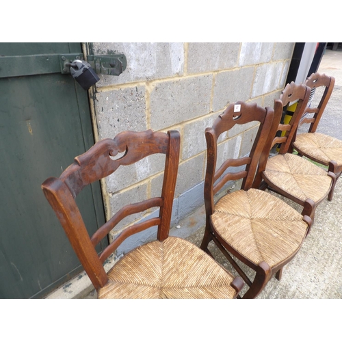 47 - A set of four French rush seat kitchen chairs