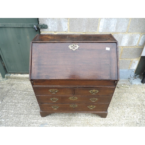 48 - A Georgian oak bureau, fitted to the interior with 2 secret compartments 90cm wide