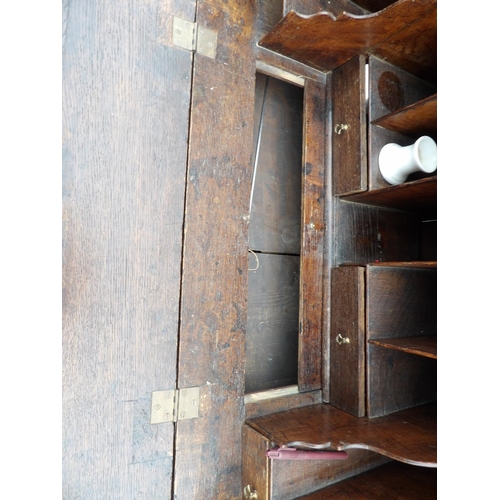 48 - A Georgian oak bureau, fitted to the interior with 2 secret compartments 90cm wide