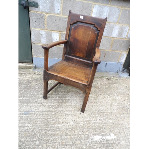 58 - An antique oak panel back chair