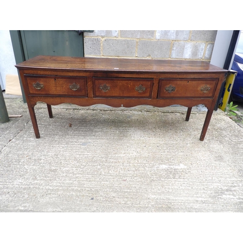 64 - A 18th century oak three drawer dresser base 182x50x77