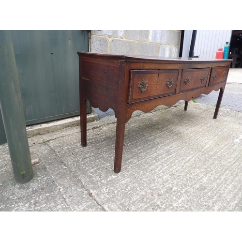 64 - A 18th century oak three drawer dresser base 182x50x77