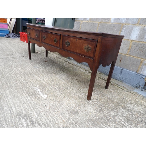 64 - A 18th century oak three drawer dresser base 182x50x77