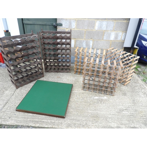 79 - A collection of five wine racks and a card table