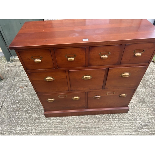 93 - A modern hardwood nine drawer chest by JOHN LEWIS 110x45 x110