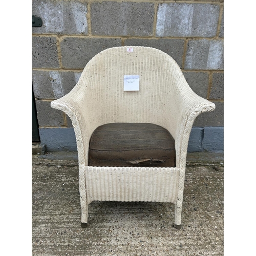 97 - A white painted lloyd loom chair with original paper label