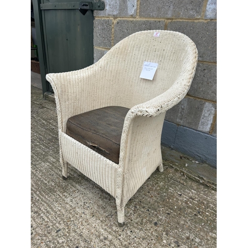 97 - A white painted lloyd loom chair with original paper label