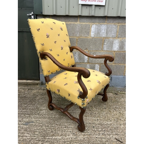 98 - A mahogany framed yellow upholstered throne chair