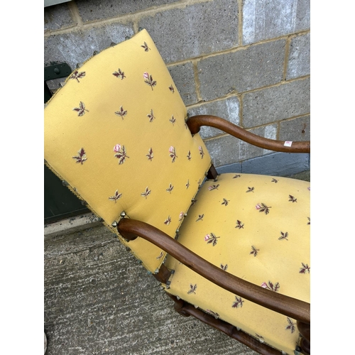 98 - A mahogany framed yellow upholstered throne chair