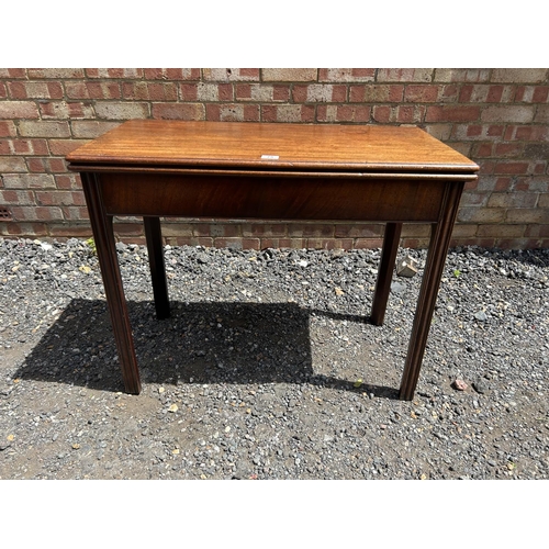 100Z - A Georgian mahogany fold over tea table