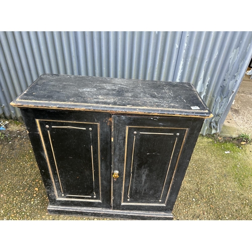 100 - An ebonised line two door cupboard 98x40x100