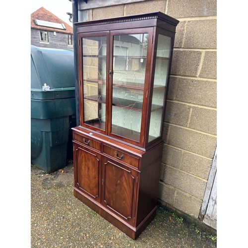 114 - A reproduction mahogany bookcase cupboard 94x40 x190