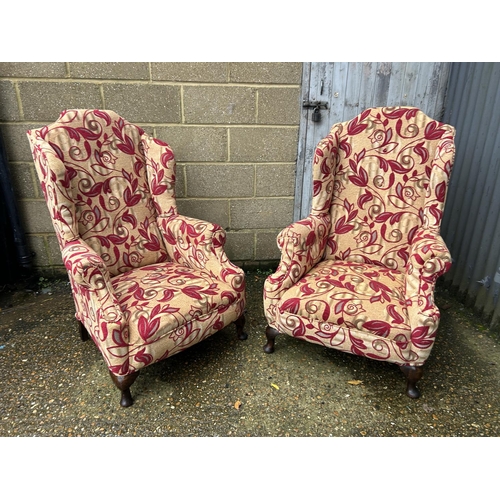 12 - Pair of red upholstered armchairs