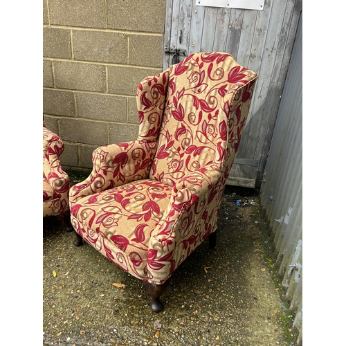 12 - Pair of red upholstered armchairs