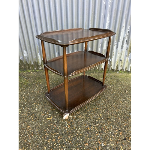 123 - An ercol dark elm tea trolley