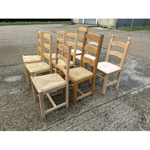 133 - A collection of nine ladder back farmhouse dining chairs assorted styles