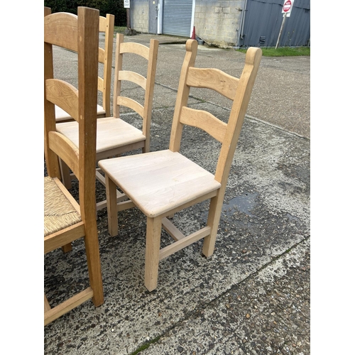 133 - A collection of nine ladder back farmhouse dining chairs assorted styles