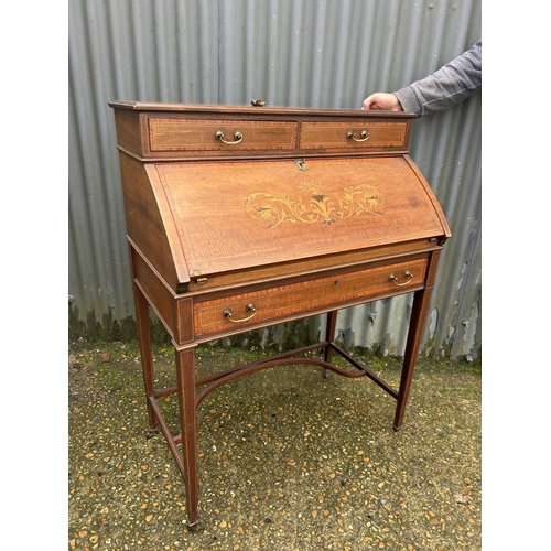 141 - An Edwardian mahogny inlaid writing desk 78x50x105