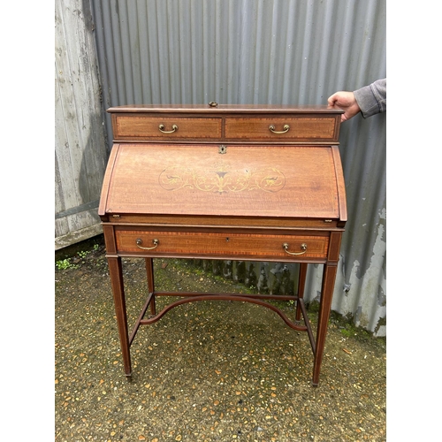 141 - An Edwardian mahogny inlaid writing desk 78x50x105