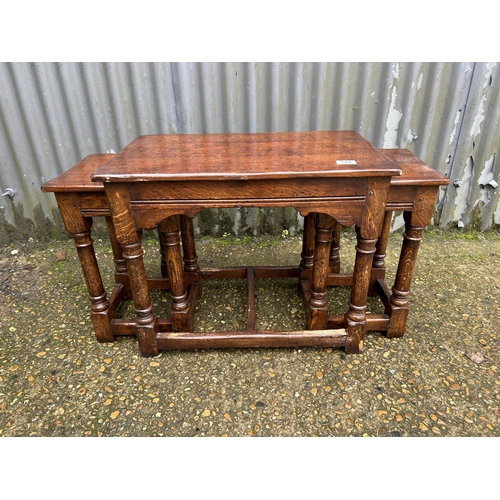 144 - A reproduction Ipswich oak nest of three tables