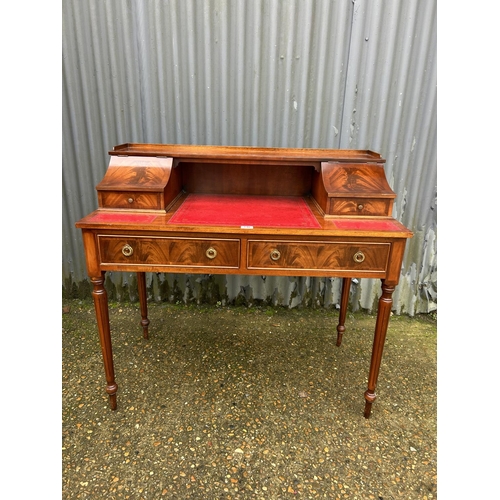 146 - A reproduction writing desk with red leather surface  106x60x100