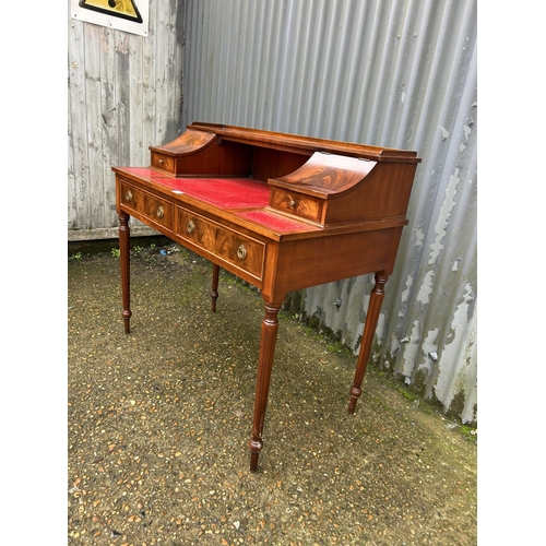 146 - A reproduction writing desk with red leather surface  106x60x100