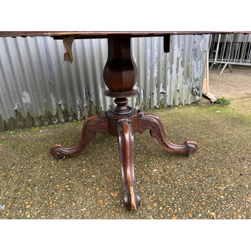 149 - A Victorian walnut tilt top centre table 150x105x85