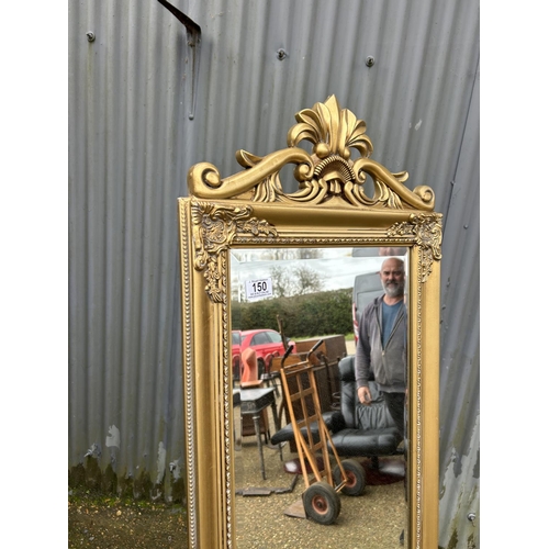 150 - A gold gilt cheval mirror